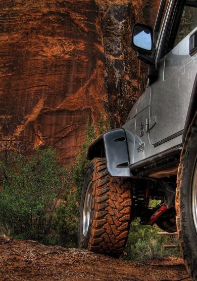 Jeep off-road vehicle navigating rocky terrain